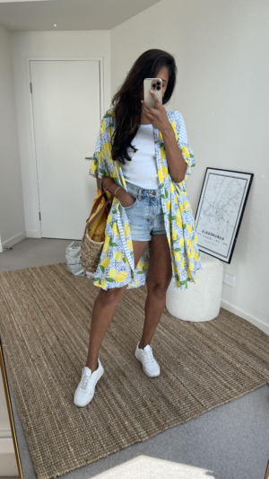 Dopamine dressing style one. Tina styles the lemon night shirt like a kimono. The night shirt is worn over a white tank, denim shorts and white sneakers. 