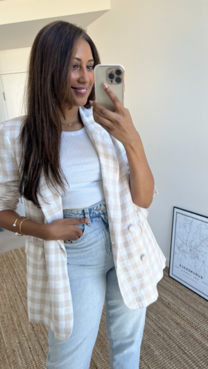 Tina styles a beige check blazer with blue jeans and a white tank